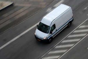 Fast moving truck on asphalt road